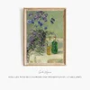 Still life with blue flowers and two bottles on a table (1907)-frame by Gerda Wegener